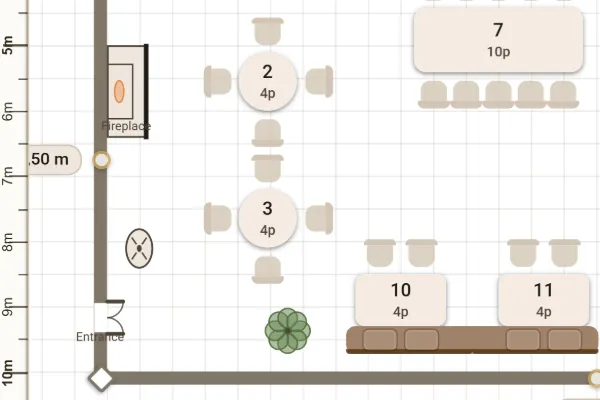 Detail of the plan: the fireplace, the entrance, two round tables and two tables with a banquette